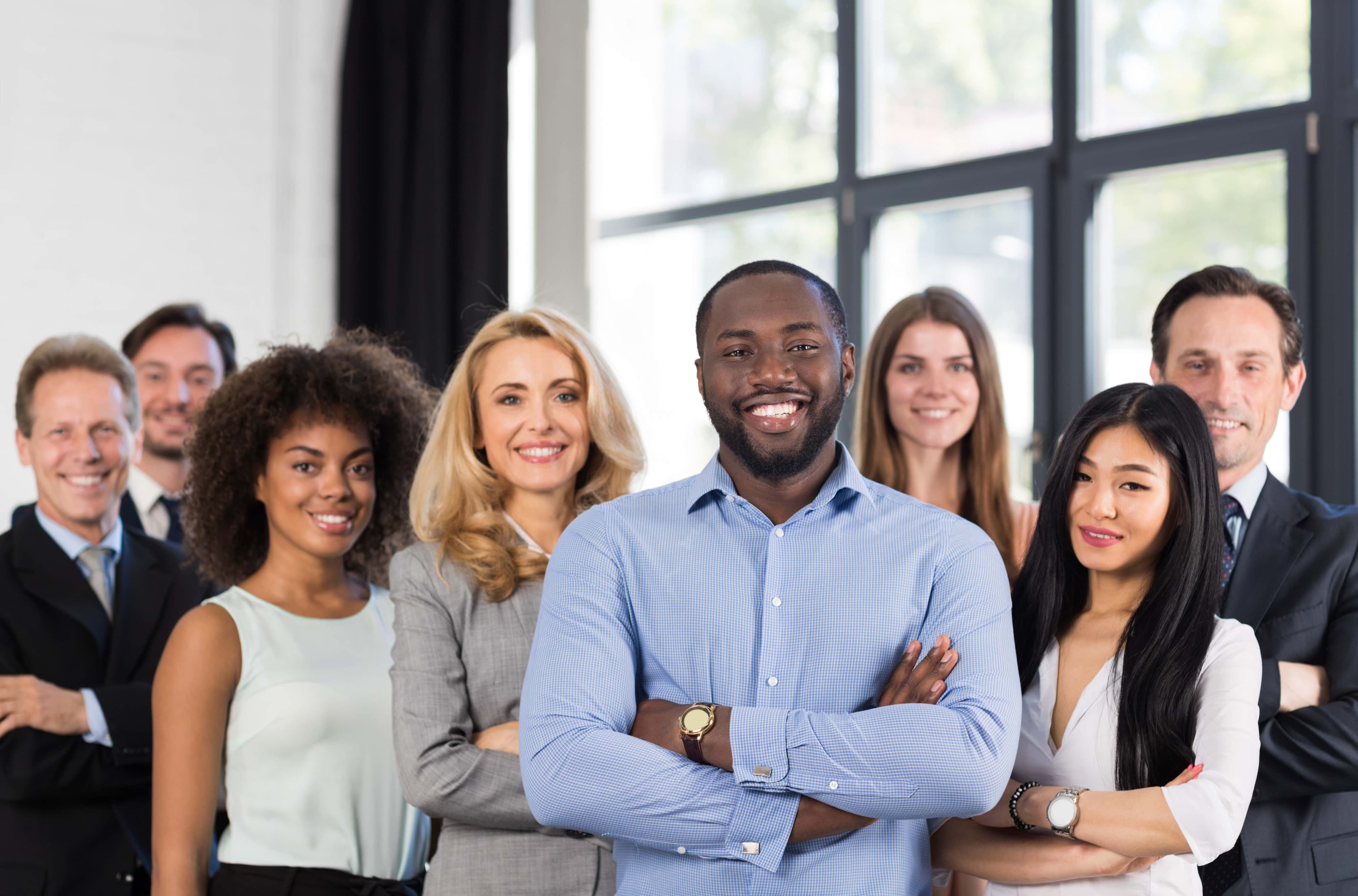 Mixed-race business team smiling